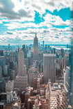 Fototapeta  - New York, United States »; January 5, 2020: Top of the Rock in New York, the Empire State Building surrounded by skyscrapers