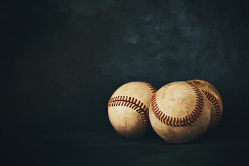 Canvas Print - Baseball ball group close up isolated on dark background for sport game concept copy space.