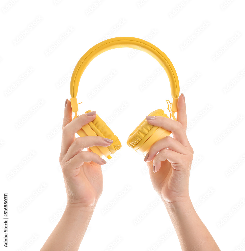 Hands with modern headphones on white background