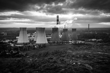 Canvas Print - Grey scale shot of the steam rising from factories in Laziska Gorne, Katowice, Poland