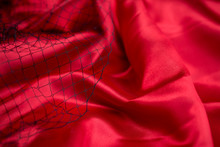 Red Satin Background With Red Flower And Net Space For Text