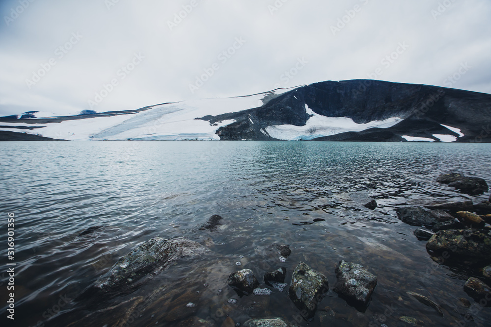 View of Galdhopiggen mountain, the highest peak and tallest mountain in Norway,  Scandinavia and Northern Europe, he municipality of Lom (in Oppland), in the Jotunheimen national park mountain area.