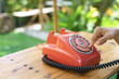 © bonnontawat - Old rotary dial landline or corded phone