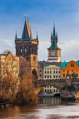 Sticker - Prague, Czech Republic - Beautiful golden sunset and blue sky at the world famous Charles Bridge (Karluv most) and Old Town Water Tower on a winter afternoon with clear blue sky