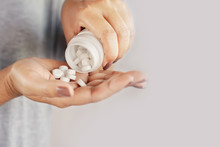 Closeup Woman Hand Holding Medicine Bottle Taking Overdose Pills 