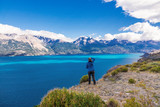 Fototapeta Do pokoju - Woman tourist hiking, Chile travel, Bertran lake and mountains beautiful landscape, Chile, Patagonia, South America