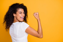 Photo Of Brunette Haired Cheerful Cute Nice Curly Wavy Trendy Youngster Showing The Power In Her Muscular Arm Shouting Satisfied About Her Achievement Isolated Vivid Color Background In White T-shirt
