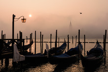 On A Foggy Winter Morning, The Bell Tower Of The San Giorgio Island Breaks Through The Fog While The Gondolas Sway Slightly In The Venice Lagoon, Venice, Veneto, Italy