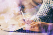© peshkova - Multi exposure of two men planing investment with stock market forex chart.