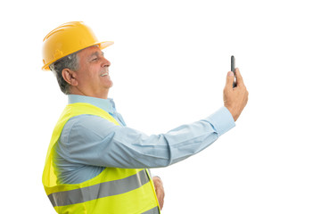 Wall Mural - Construction worker taking selfie