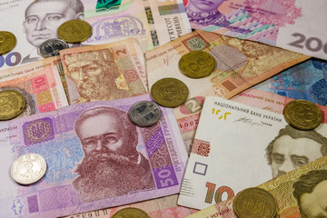 Wall Mural - Ukrainian currency. Background of different ukrainian hryvnia banknotes and coins