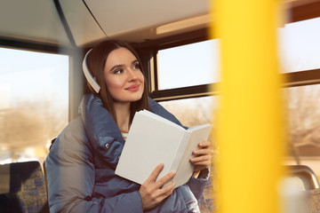 Sticker - Woman listening to audiobook in trolley bus