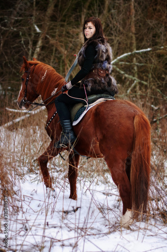 Fotomural a Viking girl riding a red horse painted in black runes