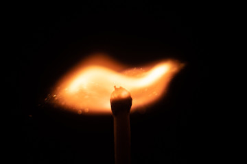 Ignition of match with sparks isolated on black background space for text fire concept passion figures variety