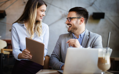 Business people having fun and chatting at workplace office