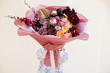 Image of cute woman with bouquet