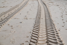Tire Tracks On Sand Beach Desert Background Texture