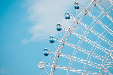 Ferris Wheel Over Blue Sky Background