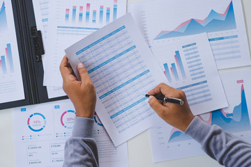 Poster - businessman working calculate data document graph chart report marketing research development planni