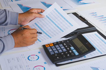 Poster - businessman working calculate data document graph chart report marketing research development planni
