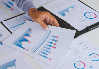 Poster - businessman working calculate data document graph chart report marketing research development planni