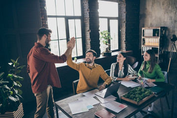 Portrait of four nice attractive glad excited cheerful cheery professional people director leader clapping palms recruitment at industrial loft interior open space style work place station