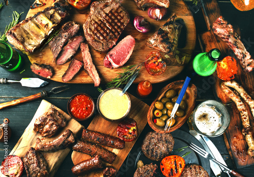 Zdjęcie: Assorted delicious grilled meat with vegetables Assorted delicious grilled meat with vegetables