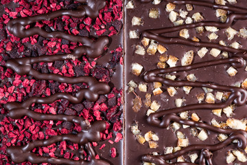 Wall Mural - Chocolate Bars Topped with Freeze - Dried Fruits. Top Down Closeup View