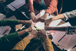 © deagreez - Top above high angle view cropped photo marketers partners put fists together round circle support start-up goals teambuilding training concept above table desk workstation workplace