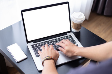 mockup image blank screen computer,cell phone with white background for advertising text,hand man using laptop texting mobile contact business search information on desk in cafe.marketing,design