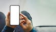 © panitan - Mockup image blank white screen cell phone.man hand holding texting using mobile.background empty space for advertise text.people contact marketing business,technology