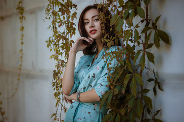 Wall Mural - Fashion portrait of young stylish woman walking on the street