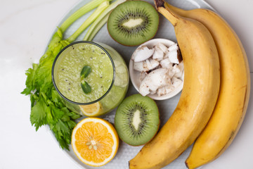 Wall Mural - smoothies and ingredients for smoothies on a plate close-up