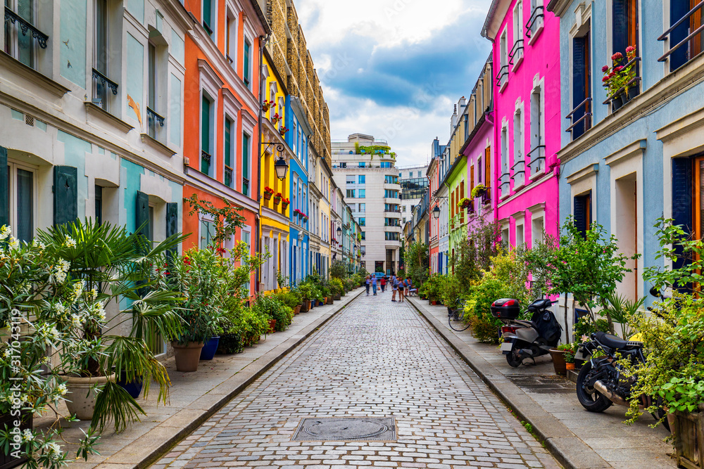 Cremieux Street (Rue Cremieux), Paris, France. Rue Cremieux in the 12th Arrondissement is one of the prettiest residential streets in Paris. Colored houses in Rue Cremieux street in Paris. France. - obrazy, fototapety, plakaty 