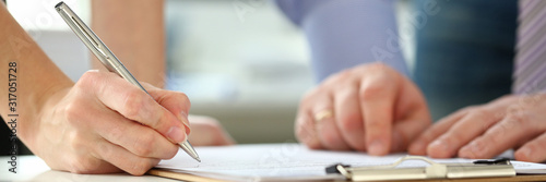 Cuadros en Lienzo Female arm offer contract form on clipboard pad and silver pen to sign closeup