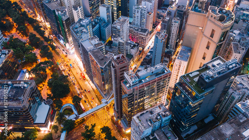 Fotografía Aerial top view of downtown district buildings in night city light