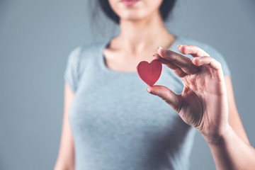 Poster - woman hand holding red heart