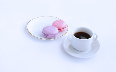 A Cup of espresso and macaroons on a white background. Everything for Breakfast.