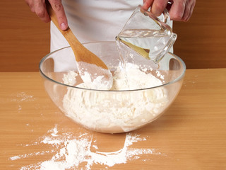 Pouring Water into Flour. Making Dough. Preparation Meat Dumplings.