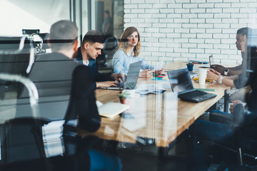 Wall Mural - Diverse partners cooperating in office room