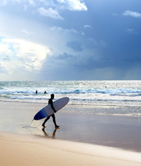 Wall Mural - Surfer surfboard beach rain Portugal