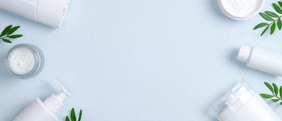 Wall Mural - natural organic spa cosmetic products set with green leaves. top view herbal skincare beauty product
