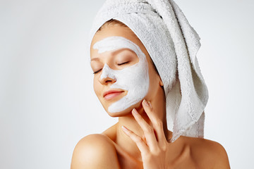 Wall Mural - cosmetology, skin care, face treatment, spa and natural beauty concept. woman with facial mask.