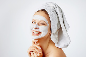 Wall Mural - cosmetology, skin care, face treatment, spa and natural beauty concept. woman with facial mask.