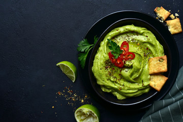 Wall Mural - Guacamole - traditional mexican spicy avocado dip. Top view with copy space.