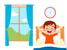 Happy Cute Little Kid Boy Wake Up In The Morning