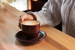 © New Africa - Woman with aromatic coffee at table in cafe, closeup