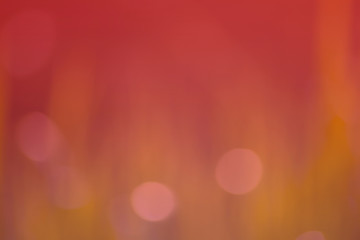 The abstract background of a blurred and soft red bokeh