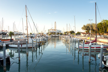 Fototapete - View on mooring of sail boats in sea harbor. Sailboats moored in pier