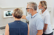 © contrastwerkstatt - Dentists explaining an x-ray to a female patient